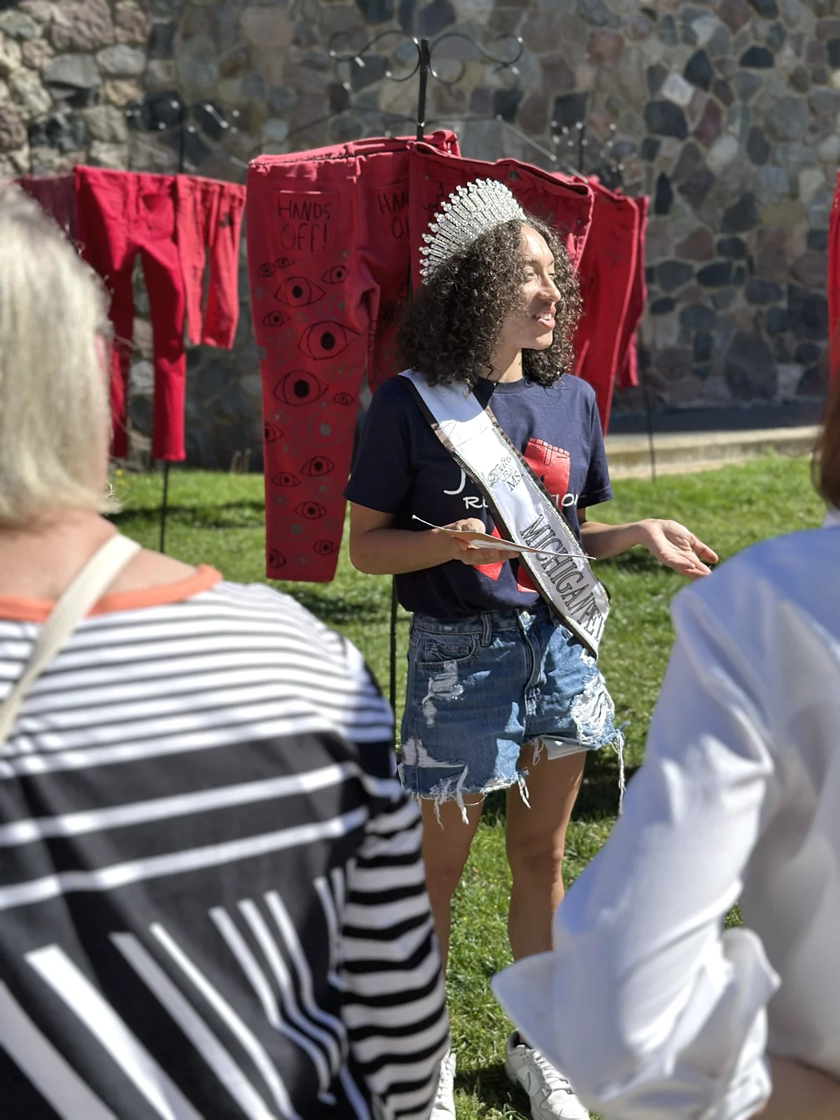 Dez Durden speaking outdoors during a community advocacy event